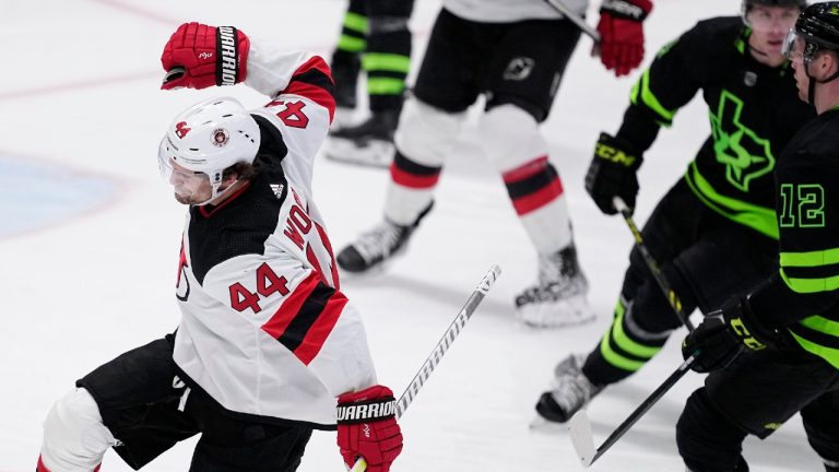 New Jersey Devils left wing Miles Wood (44) celebrates afer scoring in the second period of an NHL hockey game as Dallas Stars' Radek Faksa (12) looks on, Friday, Jan. 27, 2023, in Dallas. (Tony Gutierrez/AP)