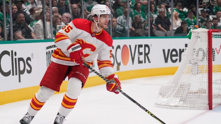 Calgary Flames defenseman Noah Hanifin skates with the puck against the Dallas Stars during the first period of Game 6 of an NHL hockey Stanley Cup first-round playoff series, Friday, May 13, 2022, in Dallas. (Tony Gutierrez/AP)