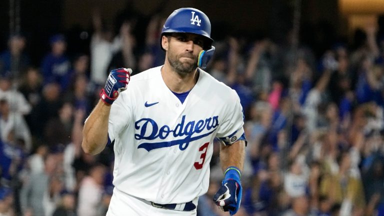 Los Angeles Dodgers' Chris Taylor gestures as he heads to firs after hitting a grand slam during the sixth inning of a baseball game against the Chicago White Sox Thursday, June 15, 2023, in Los Angeles. (Mark J. Terrill/AP)