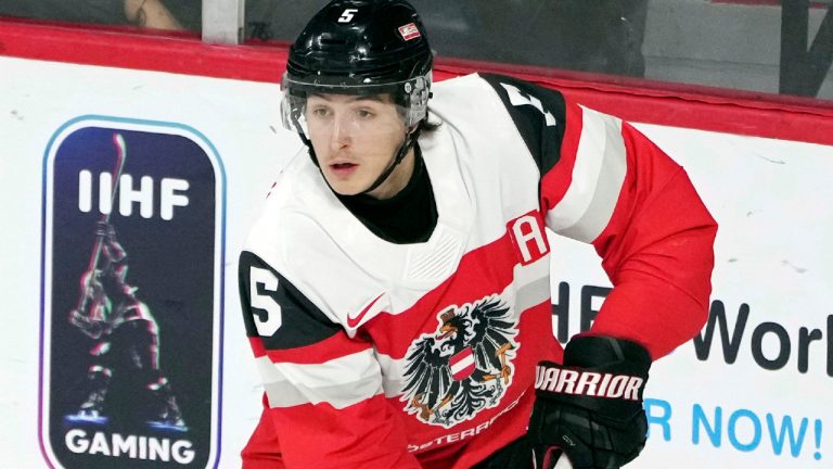 Austria's David Reinbacher handles the puck during the first period against Germany at the world junior hockey championships in Halifax, Nova Scotia, Friday, Dec. 30, 2022. (Darren Calabrese/The Canadian Press via AP, FIle)