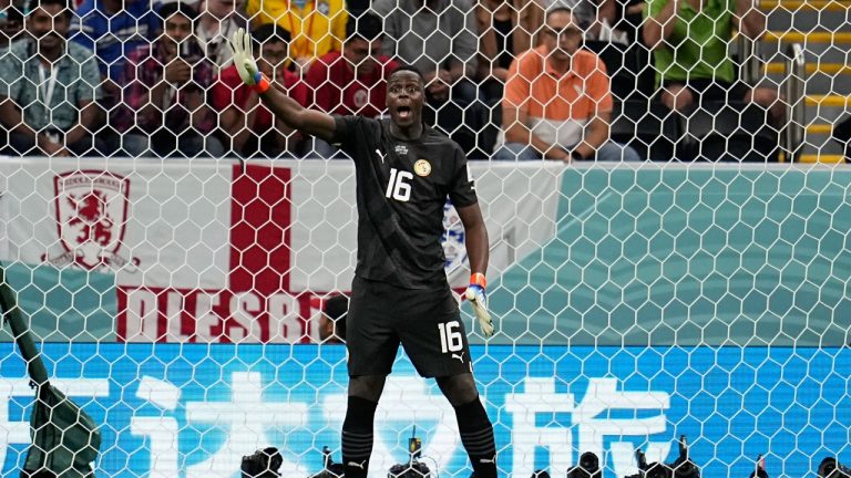 Senegal's goalkeeper Edouard Mendy directs his team during the World Cup round of 16 soccer match between England and Senegal, at the Al Bayt Stadium in Al Khor, Qatar, Sunday, Dec. 4, 2022. (Abbie Parr/AP)