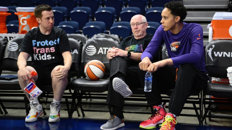 Phoenix Mercury centre Brittney Griner, right, talks with Washington Mystics coach Eric Thibault, left, and general manager Mike Thibault before a WNBA basketball game Friday, June 16, 2023, in Washington. (Nick Wass/AP)