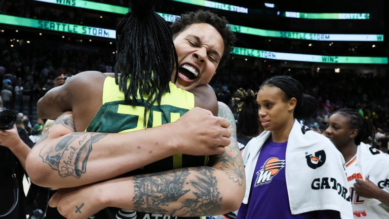 Phoenix Mercury centre Brittney Griner, centre, hugs Seattle Storm guard Jewell Loyd, left, after a WNBA basketball game Saturday, June 24, 2023, at Climate Pledge Arena in Seattle. (Kevin Clark/The Seattle Times via AP)