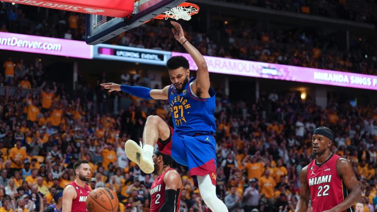 Denver Nuggets guard Jamal Murray, centre, dunks against the Miami Heat during the first half of Game 1 of basketball's NBA Finals, Thursday, June 1, 2023, in Denver. (Jack Dempsey/AP)