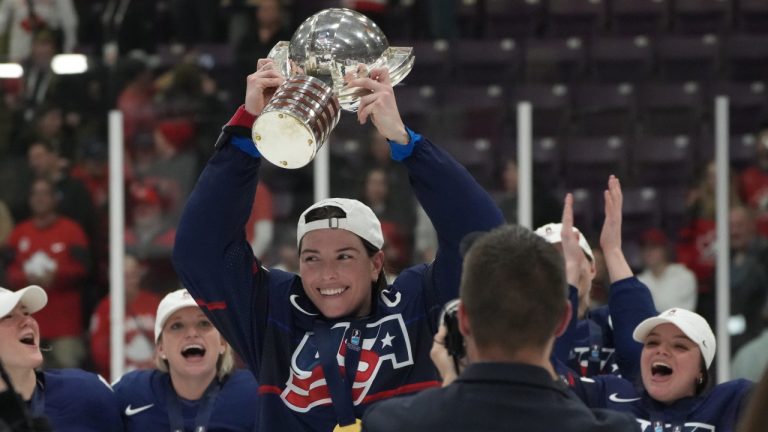 USA forward Hilary Knight (21) holds the cup as she celebrates victory with teammates after IIHF Women's World Hockey Championship gold metal hockey action against Canada in Brampton, Ont., on Sunday, April 16, 2023. (CP)