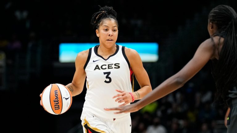 Las Vegas Aces forward Candace Parker (3) drives against Seattle Storm center Ezi Magbegor (13) during the second half of a WNBA basketball game Saturday, May 20, 2023, in Seattle. The Aces won 105-64. (Lindsey Wasson/AP)