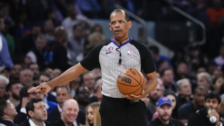 Referee Eric Lewis gestures during the first half of Game 5 of the NBA basketball Eastern Conference semifinal between the New York Knicks and the Miami Heat on May 10, 2023, in New York. Lewis was not selected as one of the 12 referees who will work the NBA Finals between the Denver Nuggets and Miami Heat, while the league continues to look into whether he used a Twitter account to defend himself and other officials from online critiques. Lewis had been chosen to work the finals in each of the last four seasons. (Frank Franklin II/AP)