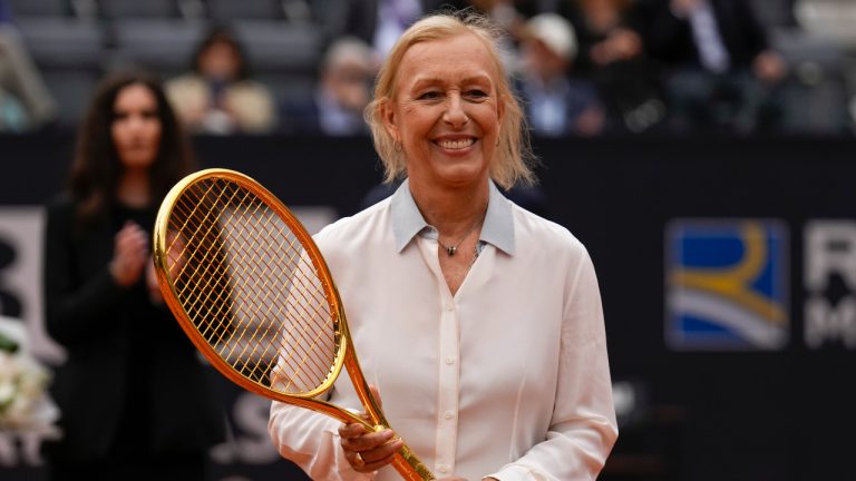 Martina Navratilova, the 18-time Grand Slam singles champion and member of the International Tennis Hall of Fame, smiles holding the Racchetta d'Oro (Golden Racket) award she received from the Italian Tennis Federation before the men's final tennis match at the Italian Open tennis tournament in Rome, Italy, Sunday, May 21, 2023. (Alessandra Tarantino/AP)