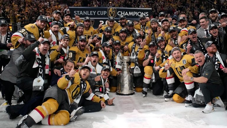 Members of the Vegas Golden Knights pose with the Stanley Cup after the Knights defeated the Florida Panthers 9-3 in Game 5 of the NHL hockey Stanley Cup Finals Tuesday, June 13, 2023, in Las Vegas. The Knights won the series 4-1. (John Locher/AP)