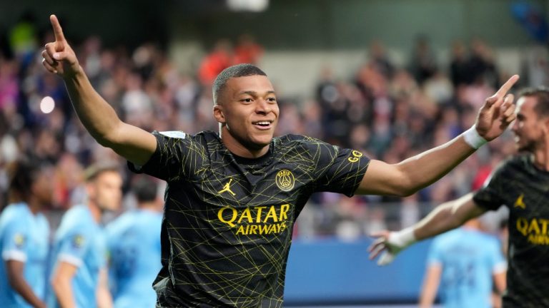 PSG's Kylian Mbappe celebrates after scoring his side's opening goal during the French League One soccer match between Troyes and Paris Saint Germain, at the Stade de l'Aube, in Troyes, France, Sunday, May 7, 2023. (Lewis Joly/AP)