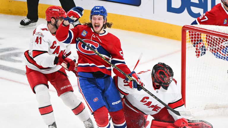 Montreal Canadiens' Michael Pezzetta (55) reacts after scoring against Carolina Hurricanes goaltender Frederik Andersen as Hurricanes' Shayne Gostisbehere (41) looks on during second period NHL hockey action in Montreal, Tuesday, March 7, 2023. (Graham Hughes/CP)