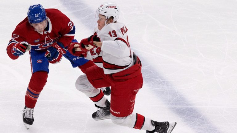 Montreal Canadiens centre Rem Pitlick loses control of his stick after colliding with Carolina Hurricanes right wing Jesse Puljujarvi during second period NHL hockey action. (Allen McInnis/CP)