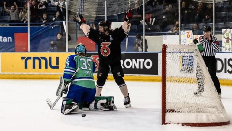 Toronto Six defender Kati Tabin celebrates a goal in front of Connecticut Whales goalie Abbie Ives (35) during PHL playoff action in Toronto in a March 18, 2023, handout photo. The Toronto Six have re-signed Tabin to a two-year, US$220,000 contract through the 2024-25 Premier Hockey Federation season. (CP/HO-Toronto Six, Lori Bolliger)