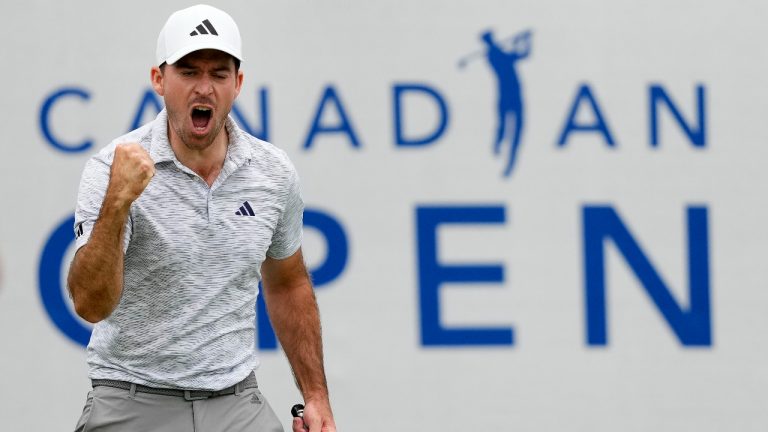 Nick Taylor, of Canada, reacts after sinking his putt on the 18th hole during final round golf action at the Canadian Open championship in Toronto on Sunday, June 11, 2023. (Andrew Lahodynskyj/CP)