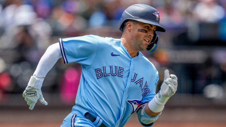 Toronto Blue Jays' Whit Merrifield runs to second on a two-run double off New York Mets starting pitcher Kodai Senga in the second inning of a baseball game, Sunday, June 4, 2023, in New York. (John Minchillo/AP)