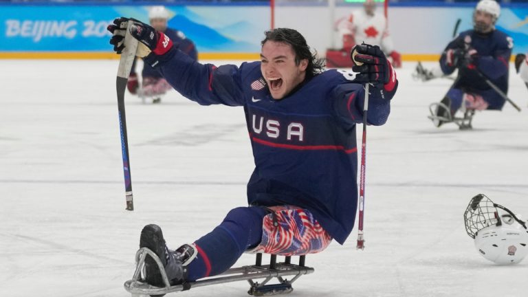 Jack Wallace of the United States celebrates after his team defeated Canada in their para ice hockey gold medal match at the 2022 Winter Paralympics, Sunday, March 13, 2022, in Beijing. (Dita Alangkara/AP)