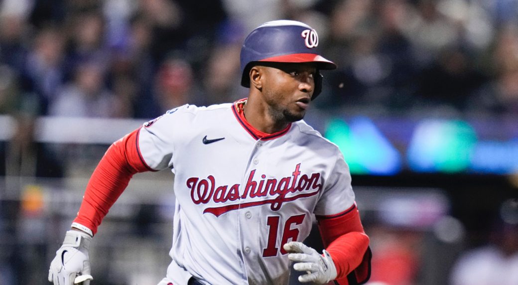 Washington Nationals' Victor Robles climbs the steps to the dugout