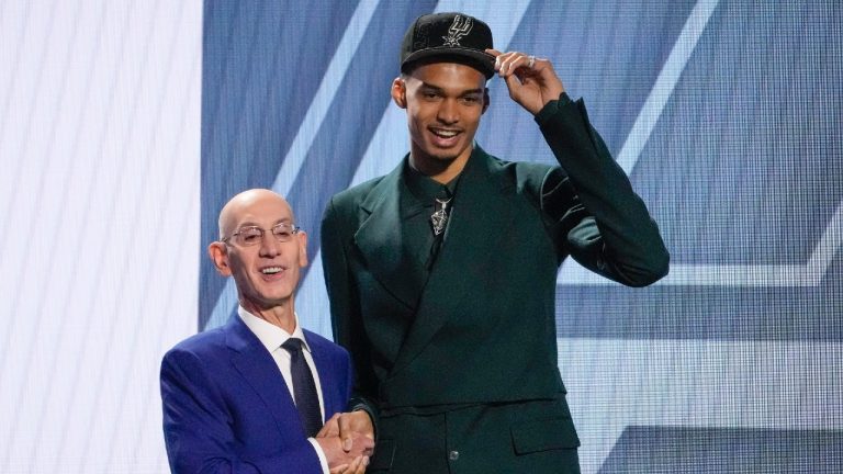 Victor Wembanyama poses for a photo with NBA commissioner Adam Silver after being selected first overall by the San Antonio Spurs during the NBA basketball draft, Thursday, June 22, 2023, in New York. (John Minchillo/AP)