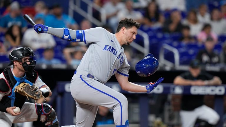 Kansas City Royals' Vinnie Pasquantino catches his batting helmet as he strikes out swinging during the fourth inning of a baseball game against the Miami Marlins, Tuesday, June 6, 2023, in Miami. (Wilfredo Lee/AP)