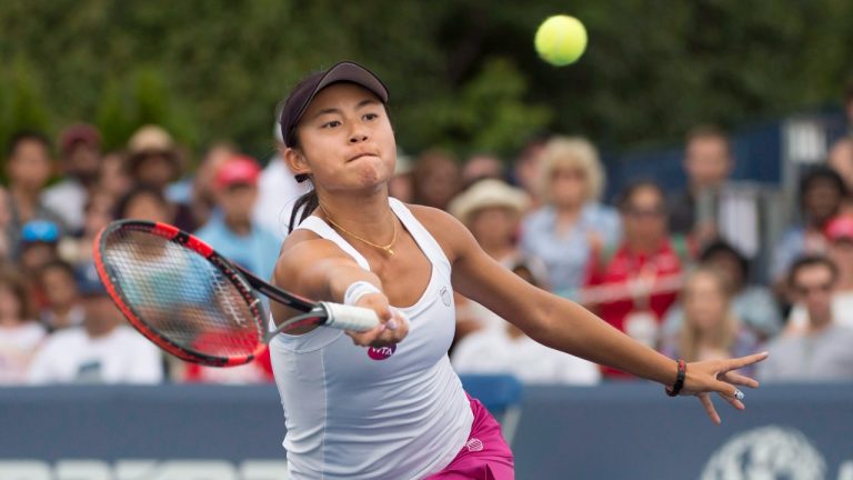 Carol Zhao, of Canada, hits a return. (CP)