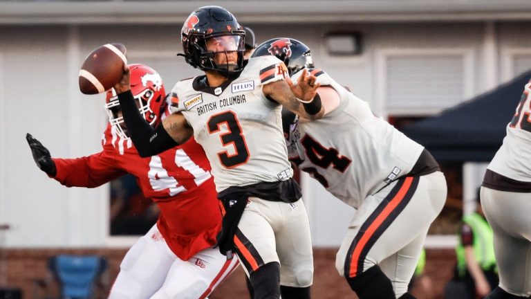 B.C. Lions quarterback Vernon Adams, centre, throws the ball during second half CFL football action against the Calgary Stampeders in Calgary, Thursday, June 8, 2023. (Jeff McIntosh/THE CANADIAN PRESS)