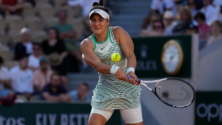 Canada's Bianca Andreescu returns the ball to Ukraine's Lesia Tsurenko during their third round match of the French Open tennis tournament at the Roland Garros stadium in Paris, Saturday, June 3, 2023. (Thibault Camus/AP)