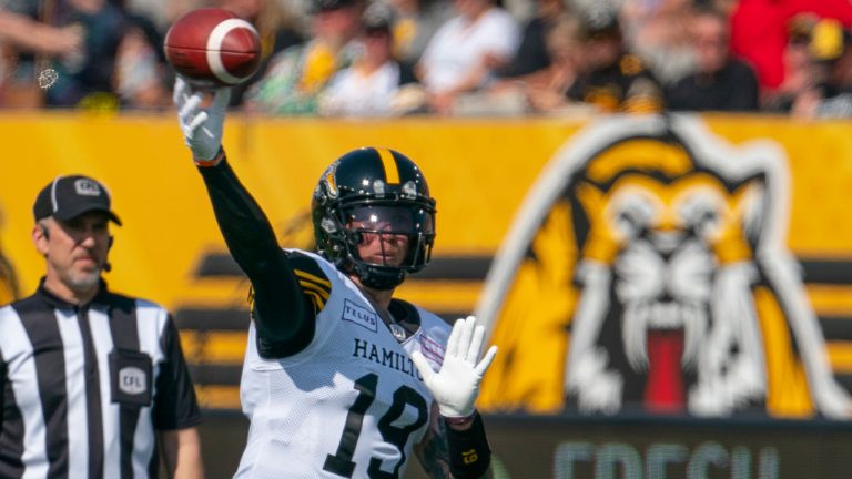 Hamilton Tiger Cats quarterback Bo Levi Mitchell (19) passes against the Toronto Argonauts during first half CFL pre-season football action in Hamilton. (Peter Power/THE CANADIAN PRESS)