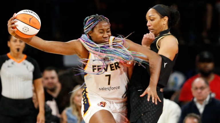 Indiana Fever forward Aliyah Boston (7) drives against Las Vegas Aces forward A'ja Wilson during the first half of a WNBA basketball game Saturday, June 24, 2023, in Las Vegas. (Steve Marcus/Las Vegas Sun via AP)