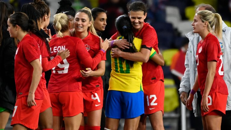 Canada midfielder Christine Sinclair (12) hugs Brazil forward Marta (10) after Canada defeated Brazil 2-0 in an SheBelieves Cup soccer match Sunday, Feb. 19, 2023, in Nashville, Tenn. (Mark Zaleski/AP)