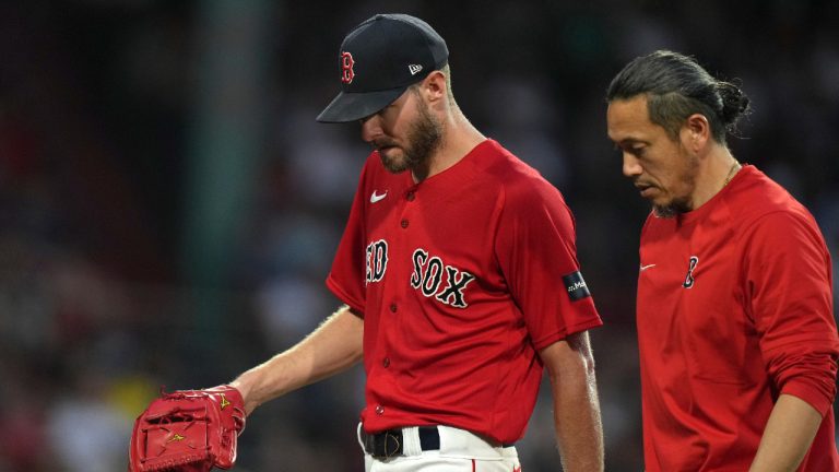 Boston Red Sox's Chris Sale, left, walks to the dugout after being removed during the fourth inning of the team's baseball game against the Cincinnati Reds, Thursday, June 1, 2023, in Boston. (Steven Senne/AP)