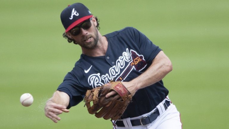 FILE - Atlanta Braves' Charlie Culberson throws to first after fielding a ground ball during a practice baseball game, Thursday, July 9, 2020, in Atlanta. The Atlanta Braves designated infielder Culberson for assignment hours before his father was set to throw out a ceremonial first pitch on Father's Day, Sunday, June 18, 2023. (John Bazemore/AP)