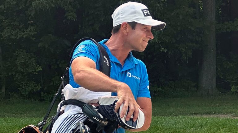 Viktor Hovland carries the bag of Zach Bauchou during U.S. Open qualifying at Brookside Golf & Country Club in Columbus, Ohio, Monday, June 5, 2023. One day after Hovland won the Memorial Tournament and a $3.6 million prize, he caddied 36 holes for his former Oklahoma State teammate. (Doug Ferguson/AP)