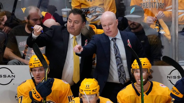 Nashville Predators coach John Hynes, top right, and assistant coach Dan Lambert gesture to players during the third period of the team's NHL hockey game against the Colorado Avalanche on Friday, April 14, 2023, in Nashville, Tenn. (Mark Humphrey/AP Photo)