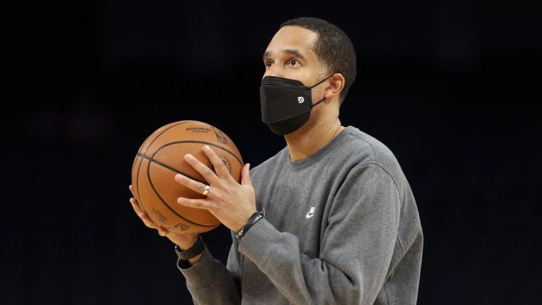 Golden State Warriors assistant coach and director of player development Jama Mahlalela watches as players practice before an NBA basketball game against the Detroit Pistons in San Francisco, Tuesday, Jan. 18, 2022. (AP Photo)