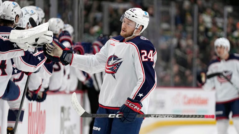 Columbus Blue Jackets right wing Mathieu Olivier (24) celebrates with teammates after scoring a goal against the Minnesota Wild. (Abbie Parr/AP)