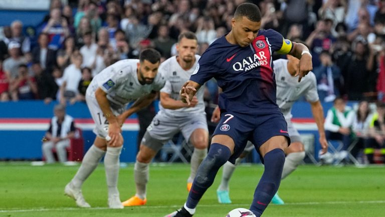 PSG's Kylian Mbappe scores his side's second goal from a penalty kick during the French League One soccer match between Paris Saint-Germain and Clermont at the Parc des Princes in Paris, France, Saturday, June 3, 2023. (Michel Euler/AP)