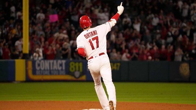 Los Angeles Angels' Shohei Ohtani celebrates as he rounds second after hitting a solo home run during the seventh inning of a baseball game against the Chicago White Sox Tuesday, June 27, 2023, in Anaheim, Calif. (Mark J. Terrill/AP)