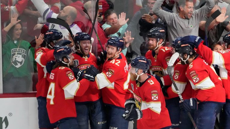 The Florida Panthers crowd around centre Carter Verhaeghe (23), third from left, after he scored the game winning goal during overtime in Game 3 of the NHL hockey Stanley Cup Final, Thursday, June 8, 2023, in Sunrise, Fla. The Florida Panthers defeated the Vegas Golden Knights 3-2. (Rebecca Blackwell/AP Photo)