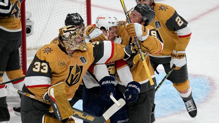 Vegas Golden Knights goaltender Adin Hill (33) and center Jack Eichel (9) throw punches at Florida Panthers center Nick Cousins swings during the first period of Game 1 of the NHL hockey Stanley Cup Finals, Saturday, June 3, 2023, in Las Vegas. (Abbie Parr/AP Photo)