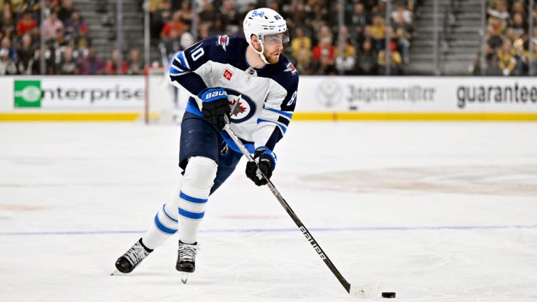 Winnipeg Jets left wing Pierre-Luc Dubois skates with the puck against the Vegas Golden Knights during the first period of Game 5 of an NHL hockey Stanley Cup first-round playoff series Thursday, April 27, 2023, in Las Vegas. (David Becker/CP)