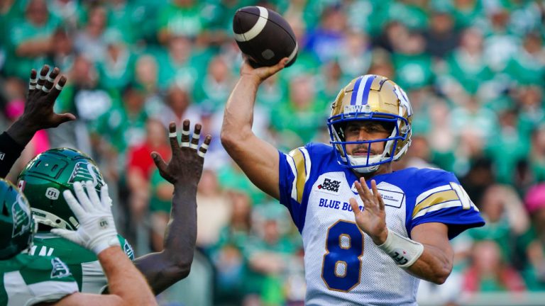 Winnipeg Blue Bombers quarterback Zach Collaros (8) throws against the Saskatchewan Roughriders during the first half of CFL football action in Regina, on Friday, June 16, 2023. (Heywood Yu/CP)