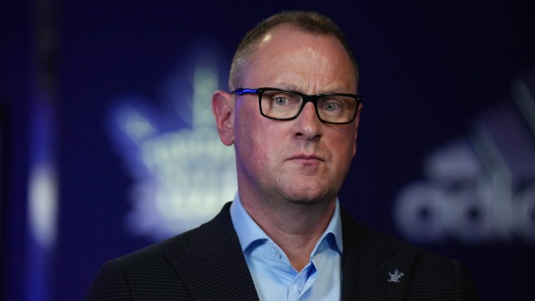 Toronto Maple Leafs general manager Brad Treliving does a television interview following a news conference in Toronto, on Thursday, June 1, 2023. (Chris Young/CP)