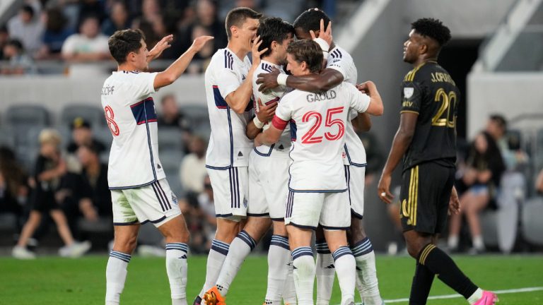 Vancouver Whitecaps forward Brian White (24) celebrates with teammates after scoring during the first half of an MLS soccer match against Los Angeles FC in Los Angeles, Saturday, June 24, 2023. (Ashley Landis/AP)