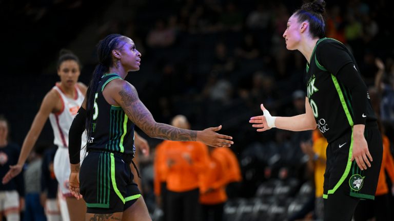 Lynx forward Jessica Shepard, right, greets guard Tiffany Mitchell after Mitchell scored against the Connecticut Sun during the first half of a WNBA basketball game Thursday, June 1, 2023, in Minneapolis. (Aaron Lavinsky/Star Tribune via AP)