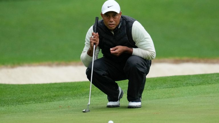 Tiger Woods lines up a putt on the 16th hole during the weather delayed second round of the Masters golf tournament at Augusta National Golf Club on Saturday, April 8, 2023, in Augusta, Ga. (Mark Baker/AP)