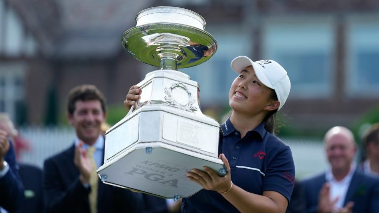 Ruoning Yin, of China, holds the trophy after winning the Women's PGA Championship golf tournament, Sunday, June 25, 2023, in Springfield, N.J. (Seth Wenig/AP)