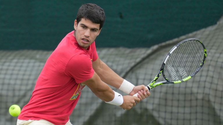 Carlos Alcaraz of Spain takes part in a practice session ahead of the Wimbledon tennis championships at Wimbledon, in London, Sunday, July 2, 2023. (AP)