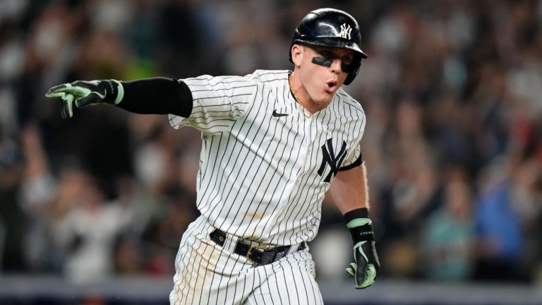 New York Yankees' Harrison Bader gestures to teamamtes after hitting a three-run home run during the eighth inning of a baseball game against the Baltimore Orioles. (Frank Franklin II/AP)