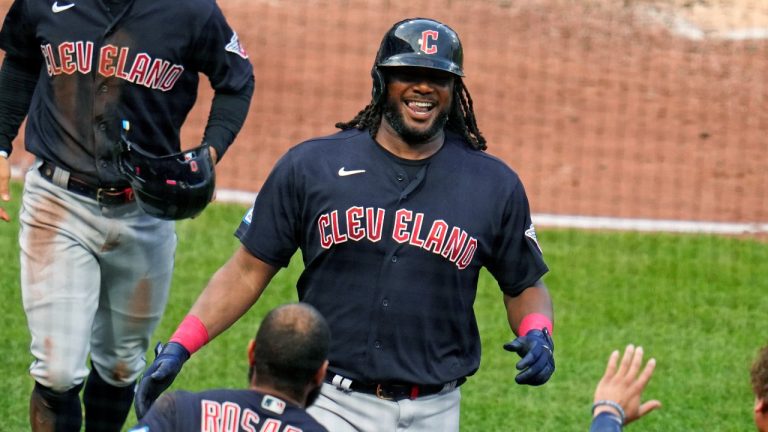 Cleveland Guardians designated hitter Josh Bell, center, returns to the dugout after hitting a two-run home run off Pittsburgh Pirates starting pitcher Mitch Keller during the third inning of a baseball game in Pittsburgh, Tuesday, July 18, 2023. (Gene J. Puskar/AP Photo)