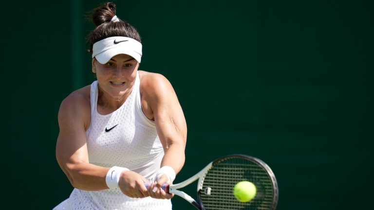 Canada's Bianca Andreescu returns to Ukraine's Anhelina Kalinina in a women's singles match on day five of the Wimbledon tennis championships in London, Friday, July 7, 2023. (Kin Cheung/AP)